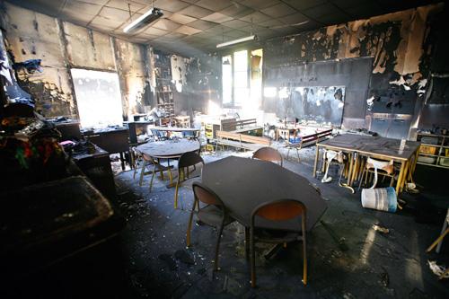 A damaged classroom is seen in a nursery school that was vandalized and set on fire in Villiers-le-Bel, a suburb north of Paris, Tuesday during the riots. Jacques Brinon, The Associated Press
