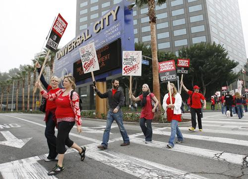 Writers Guild of America members picket Universal studios in Los Angeles on the first day of the strike, Monday. Erica Magda

