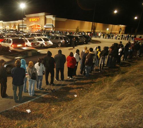 Shoppers wait in a long line to take advantage of early morning door buster deals at the Target store in Smithfield, R.I., Friday. Stores are counting on hordes of shoppers who have been pulling back in recent months. Stew Milne, The Associated Press
