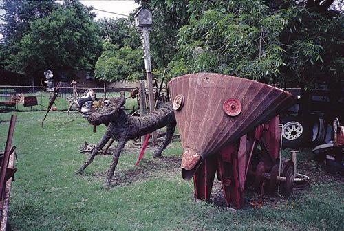This undated photo provided by the University of Texas Press shows sculptures made from old farm equipment and auto parts in Waxahachie, Texas, made by Waxahachie folk artist David Strickland. Erica Magda
