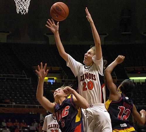 Lori Bjork rebounds the ball against two Illinois-Chicago players on Sunday. Erica Magda
