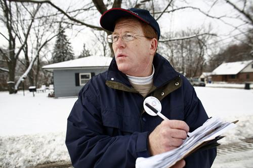 Mike Jordan, Richton Park, Ill., takes notes after talking to a potential Iowa caucus goer while campaigning for his friend, Democratic presidential hopeful, Sen. Barack Obama, D-Ill., in Cedar Rapids, Iowa, Friday, Nov. 7, 2007. Jordan, an insurance agen David Lienemann, The Associated Press
