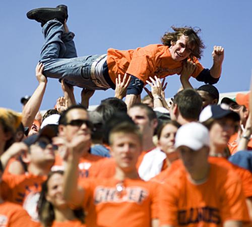 A member of the Block I surfs the crowd after Illinois scored a touchdown during the game against Penn State at Memorial Stadium in Champaign, Ill., on Sept. 29. Illinois beat No. 21 Penn State, 27-20. Erica Magda
