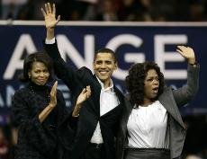 Democratic presidential hopeful, Sen. Barack Obama, D-Ill., his wife Michelle, left, and Oprah Winfrey wave to the crowd at the end of a rally in Manchester, N.H. Sunday. Elise Amendola, The Associated Press
