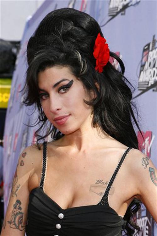 Singer Amy Winehouse arrives at the MTV Movie Awards in Los Angeles, in this June 3, 2007, file photo. Winehouse received six Grammy nominations. The Associated Press
