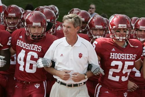 Indiana interim head coach Bill Lynch, center, is escorted onto the field by linebacker Jake Powers (46) and safety Eric McClurg (25) before a football game against Southern Illinois in Bloomington, Ind., on Sept. 16. Darron Cummings, The Associated Press

