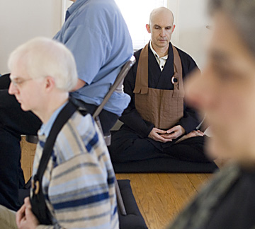 Resident teacher Elihu Genmyo Smith engages in a sitting meditation with participants at the Prairie Zen Center on Sunday. Last week the center practiced sesshin, a five-day meditation. In addition to the sesshins held six times a year, the Zen Center of Erica Magda
