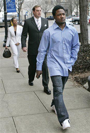 Tennessee Titans cornerback Adam "Pacman" Jones, right, leaves court with his attorney, Worrick Robinson, center, Thursday, Jan. 31, 2008, in Murfreesboro, Tenn. A judge dismissed misdemeanor charges against Jones, agreeing with a prosecutor that Jones ha Mark Humphrey, The Associated Press
