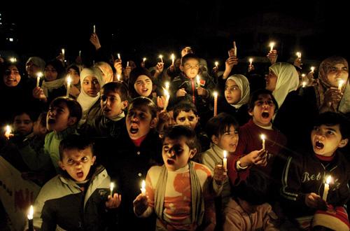 Palestinians hold candles during a demonstration against severe fuel cuts that also led to power cuts in Gaza City on Monday. Hatem Moussa, The Associated Press
