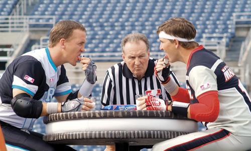 In this photo provided by Kraft, quarterback brothers Peyton, left, and Eli Manning compete in an Oreo cookie eating contest. The Associated Press
