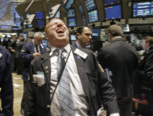 Trader Daniel Ryan laughs as he works on the floor of the New York Stock Exchange, Wednesday. Wall Street pulled off a comeback surging higher in late trading and wiping out what looked to be yet another decline. Richard Drew, The Associated Press
