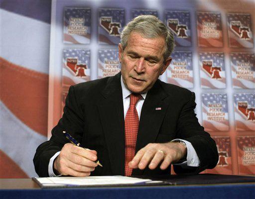 President Bush signs a 15-day extension of the Protect America Act after, Thursday, Jan. 31, 2008, in Las Vegas, delivering remarks on the Global War on Terror. The president signed the 15-day extension of the law that allows electronic surveillance of su Pablo Martinez Monsivais
