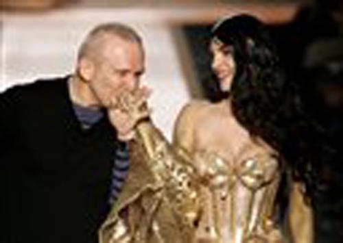 French fashion designer Jean-Paul Gaultier, left, kisses the hand of a model after the presentation of his Haute Couture Spring-Summer 2008 collection, in Paris Wednesday Jan. 23, 2008. Thibault Camus, The Associated Press
