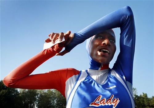 Juashaunna Kelly takes part in a cross-country meet Oct. 5, 2007, in Washington. Kelly has been disqualified from an indoor track and field meet because officials said the custom-made outfit she wears to conform to her Muslim faith violated competition ru Preston Keres, The Associated Press, The Washington Post
