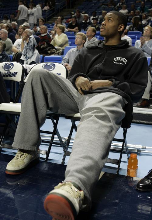 Penn State forward Geary Claxton sits on the bench in street clothes with a knee brace on Jan. 15. Claxton injured his left knee. Carolyn Kaster, The Associated Press
