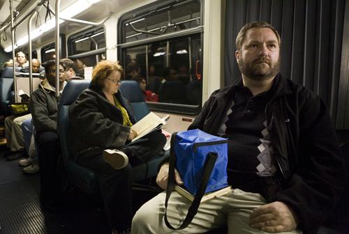 Rennie Sawade takes the bus home from his job as a programmer in downtown Seattle, Wednesday, Feb. 13, 2008. Sawade, who lives in Woodinville, Wash., recently started taking the bus home to save money. Stephen Brashear, The Associated Press
