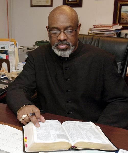 Rev. Charles Nash sits in his office in Champaign, Thursday. Erica Magda
