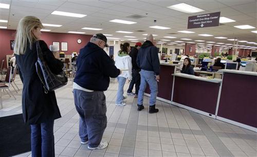 Unemployed people wait in line at the California Employment Development Department in San Jose, Calif., Wednesday, Jan. 16, 2008. The Labor Department reported Thursday that claims for unemployment benefits totaled 301,000, down 21,000 from the previous w Pamela Nisivaco
