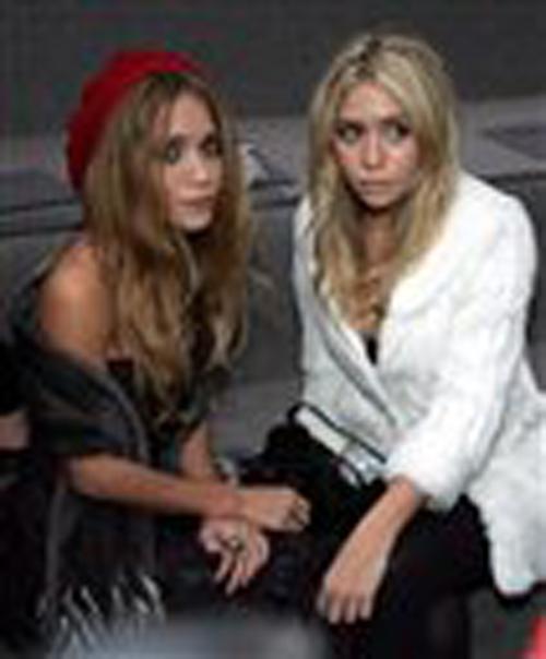 Twin+actresses+Mary-Kate%2C+left%2C+and+Ashley+Olsen+pose+for+the+press+prior+to+the+presentation+of+the+Spring-Summer+2007+ready+to+wear+collection+by+British+designer+John+Galliano+for+French+fashion+house+Dior+in+Paris%2C+in+this+Oct.+3%2C+2006+file+photo.+The+Remy+de+la+Mauviniere%2C+The+Associated+Press%0A