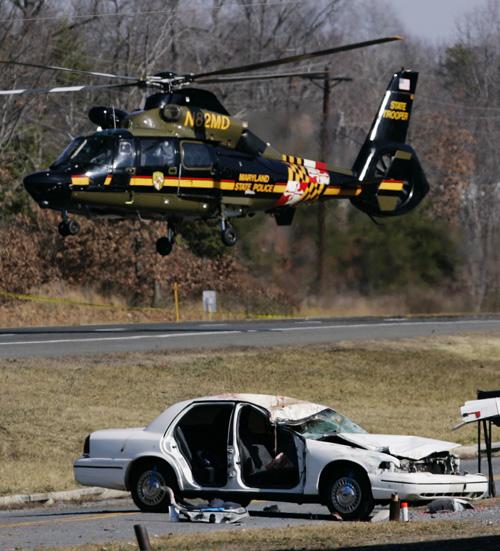 A Maryland State Police helicopter takes off from the scene of a car crash on Indian Head Highway on Saturday in Accokeek, Md. Haraz N. Ghanbari, The Associated Press
