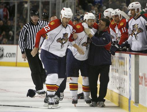 Florida Panther Richard Zednik is assisted by teammate Jassen Cullimore and a trainer after he was hurt Sunday. John Hickey, The Associated Press
