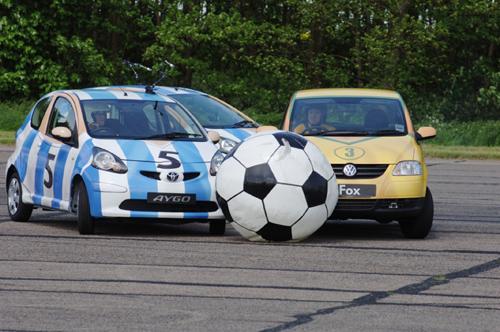 This photo released by BBC Worldwide shows a soccer stunt pitting a Toyota Aygo team against a Volkswagen Fox team during a taping of Top Gear. Charlie Gray, The Asociated Press
