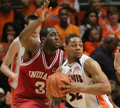 Demetri McCamey rebounds during the Indiana game at Assembly Hall on Thursday. Illinois lost in double overtime, 83-79. Erica Magda
