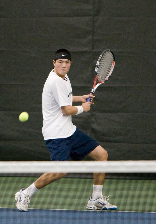 Freshman Waylon Chin readies his backhand to lead him and his partner to a 9-8 win in the tiebreak. The Illini went on to beat the LSU Tigers 6-1, on Saturday, in Urbana. Dean Santarinala
