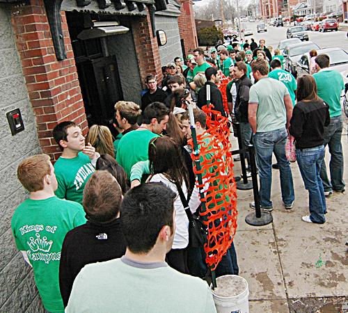 Celebrators of Unofficial stand outside in line for Station 211, 211 East Green St. in Champaign, March 2, 2007. Erica Magda
