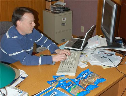 Tom Schuler, head of Internet sales for Giants Seeds in Wahpeton, N.D,, uses a laptop and personal computer Wednesday, Jan. 30, 2008 to handle orders for a protest by fans of the recently canceled USA Network show The 4400. The North Dakota sunflower se Dave Kolpack, The Associated Press

