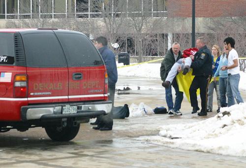 In this photo provided by the student-run Northern Star newspaper, rescue workers carry an unidentified victim from the scene of a shooting at a lecture hall at Northern Illinois University in DeKalb, Ill. on Thursday. A man dressed in black opened fire Jim Killam, The Associated Press
