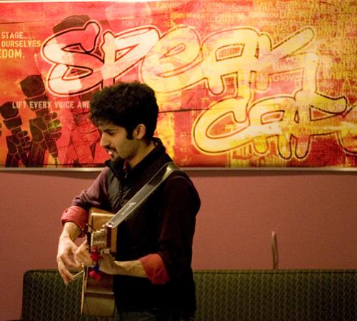 Aziz Ander, a graduate student in advertising, performs at SPEAK Cafe on Thursday at Krannert Art Museum. The next open mic night will be on Thursday, March 13. Donald Eggert
