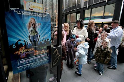 Moviegoers line up to see a screening of the 3-D film "Hannah Montana &amp; Miley Cyrus: Best of Both Worlds Concert" at the Ziegfeld theater in this Feb. 2, 2008, file photo in New York. Gary He, The Associated Press
