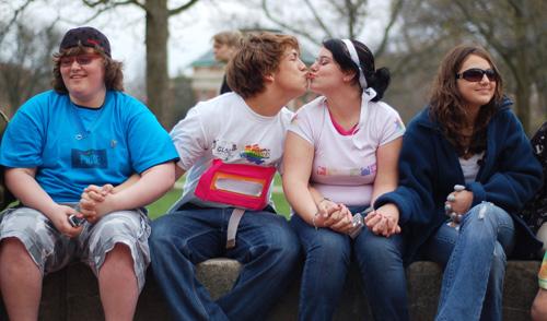 High school students from Urbana Rebekka Bear-Brister, center right, and Kendall Johnson, center left, share a kiss on the Quad, April 18, 2007. Erica Magda
