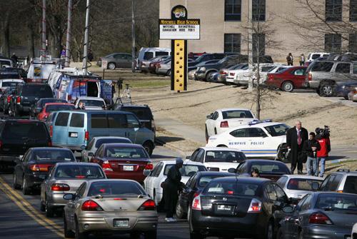Traffic backs up on Mitchell Road outside of Mitchell High School on Monday in Memphis, Tenn. An argument that began off campus ended in a gym class Monday when a teenager walked up to another student and shot him twice. The Associated Press
