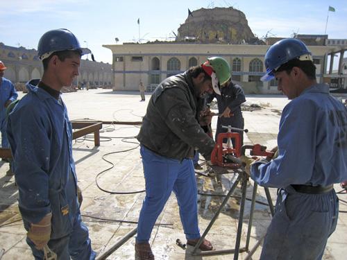 Men work to rebuild the holy Shiite shrine in Samarra, Iraq, Wednesday. Hameed Rasheed, The Associated Press
