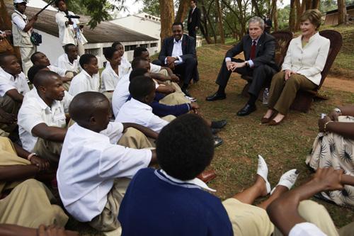President Bush and wife Laura Bush meet with student members of the Anti-AIDS Club at the Lycee De Kigali, in Kigali, Rwanda, Tuesday, which provides AIDS awareness education programs. Charles Dharapak, The Associated Press
