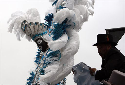 Zulu King Frank Boutte, left, gets situated on his float prior to the Krewe of Zulu Mardi Gras parade in New Orleans, Tuesday, Feb. 5, 2008 Ann Heisenfelt, The Associated Press
