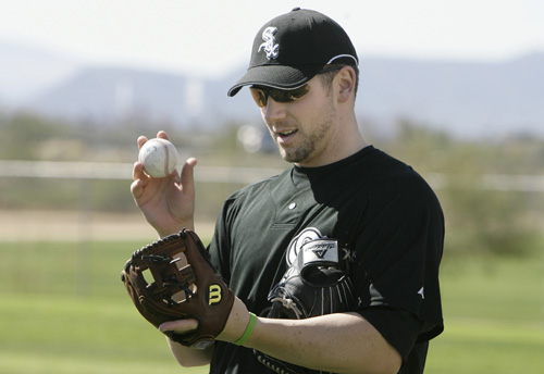 Chicago White Sox third baseman Josh Fields practices in the field after showing up early for spring training in Tucson, Ariz., on Sunday. The Associated Press
