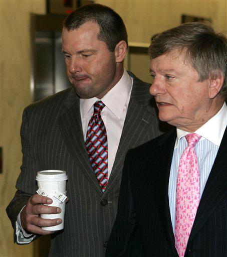 Major League Baseball pitcher Roger Clemens, left, accompanied by his attorney Rusty Hardin, arrives on Capitol Hill in Washington, Tuesday, Feb. 5, 2008, for his deposition before the House Oversight and Government Reform Committee which is investigating Evan Vucci
