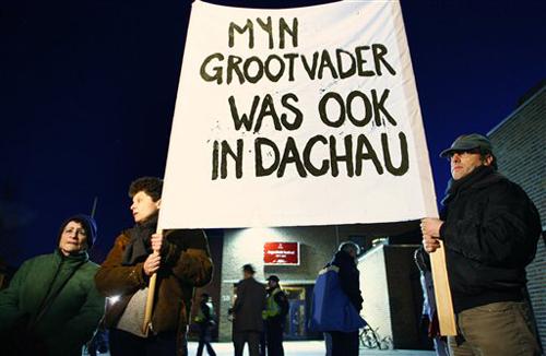 Demonstrators hold a banner reading, My grandfather was also in Dachau, during a protest outside the venue where Johan Heesters, a singer who once performed for Adolf Hitler, is to take the stage, at De Flint theater, in Amersfoort, Netherlands, Saturda Cris Toala Olivares, The Associated Press
