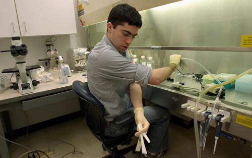Duke University junior Josh Sommer, 20, prepares to dislodge cells while conducting chordoma research at the Veteran Affairs Medical Center in Durham, N.C., Thursday, Feb. 14. Sommer was diagnosed in January 2006 with chordoma, a rare bone cancer which ha Sara D. Davis, The Associated Press
