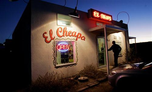 A customer enters the El Cheapo liquor store in Marfa, Texas, Wednesday, Feb. 6, 2008. The stark landscape outside Marfa shows up in the movies No Country for Old Men and There Will Be Blood, which each have eight Academy Award nominations. In six cat Eric Gay, The Associated Press
