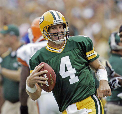 Brett Favre laughs after rushing for a first down against the Cleveland Browns in Green Bay, Wis., in this Sept. 19, 2005 file photo. Brett Favre has decided to retire from the NFL after 17 seasons. FOX Sports first reported Tuesday March 4, 2008 that the Mike Roemer
