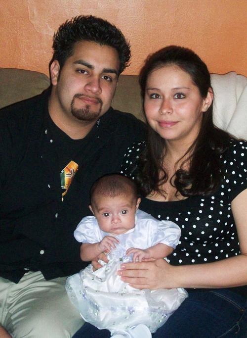 Deanna Moreno and Dennis Hernandez hold their child, Sofia. Photo courtesy of Deanna Moreno
