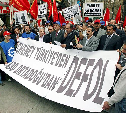 Members of a leftist Turkish party hold a banner that reads, Cheney get out of Turkey, the U.S. get out of the Middle East, in Ankara, Turkey, on Monday. The Associated Press
