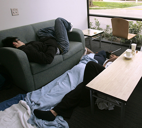 Eric Cheung, left, Selisa Ramirez, center and Israil Ruiz, right, students at the University of California, Davis, try to sleep in the dinning commons, Thursday, where they spent the night after being evacuated. Rich Pedroncelli, The Associated Press
