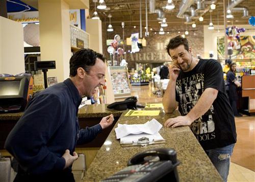 In this image released by TLC, Joey Fatone, host of the new TLC series The Singing Office reacts as supermarket manager Eric Sustin, auditions for the show in Los Angeles on March 30 2008. Melanie Brown and Joey Fatone have a new role to add to their sc Gilles Mingasson, TLC, The Associated Press
