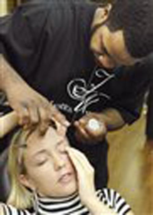 James Wealthy uses the ancient technique of threading on customer Jessica Junis on March 17, 2008, at CB Hair Design in Bloomington, Ill. The technique uses a simple piece of twisted thread to remove unwanted body hair, mainly on the eyebrows and other pa Lori Ann Cook, The Associated Press
