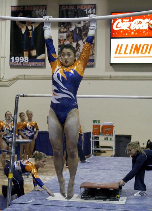 Nicole Cowart performs on the uneven bars during the meet against No. 15 Missouri in Champaign on March 8. Cowart is going to nationals. Erica Magda
